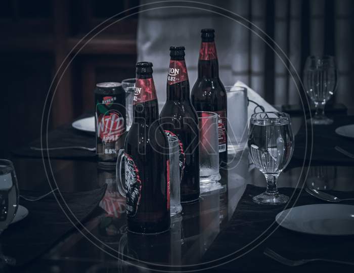 Small Gathering With Beers And Plates On The Table Night Lights Dark Photograph