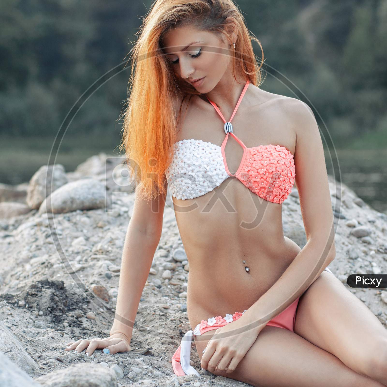 Sexy Girl With Red Hair In A Bikini On The Beach.