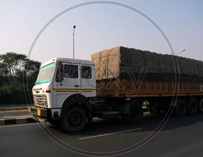 A truck or lorry carrying loads on highway