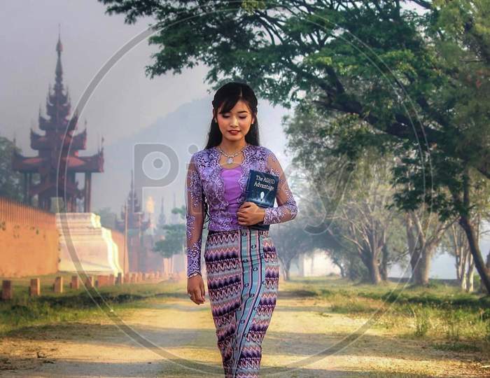 Myanmar Girl With Traditional Outfit In The Moat