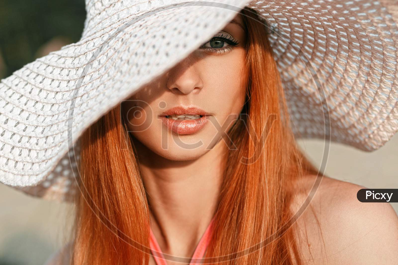 Beautiful Girl With Red Hair With A Hat On His Head