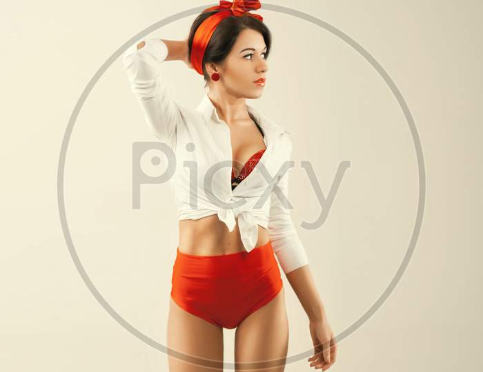 Pinup Girl In Studio. Back To 1950S