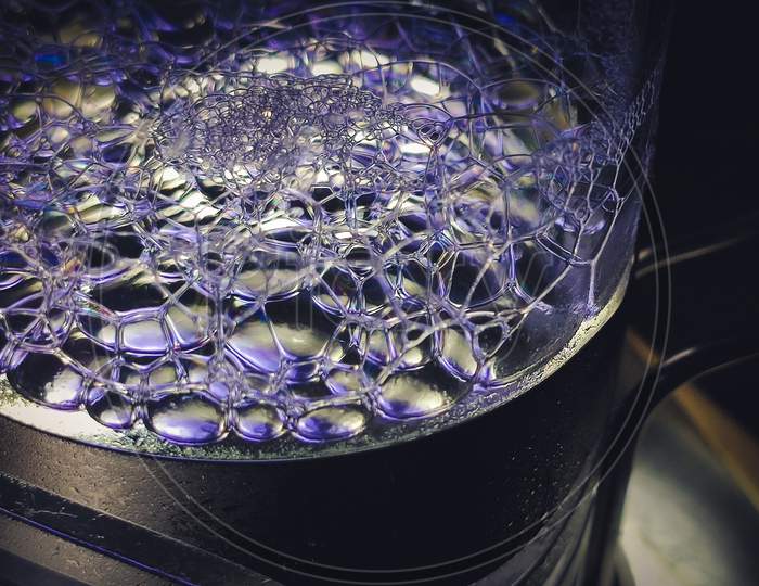 Blue And White Soap Bubbles In A Designer Glass