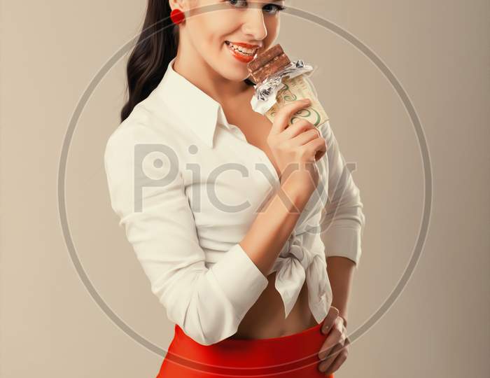 Pinup Woman With Chocolate In Studio. Back To 1950S.