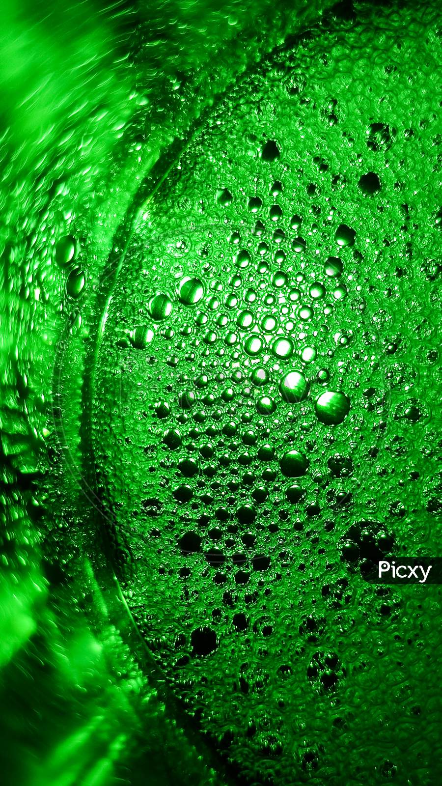 Abstract Of Green Soap Bubbles In A Glass