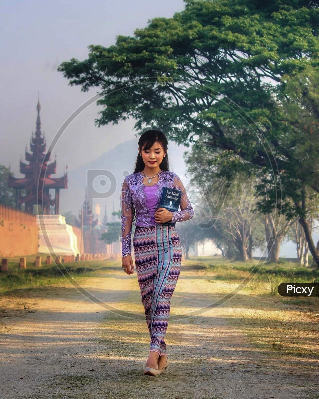 Myanmar Girl With Traditional Outfit In The Moat