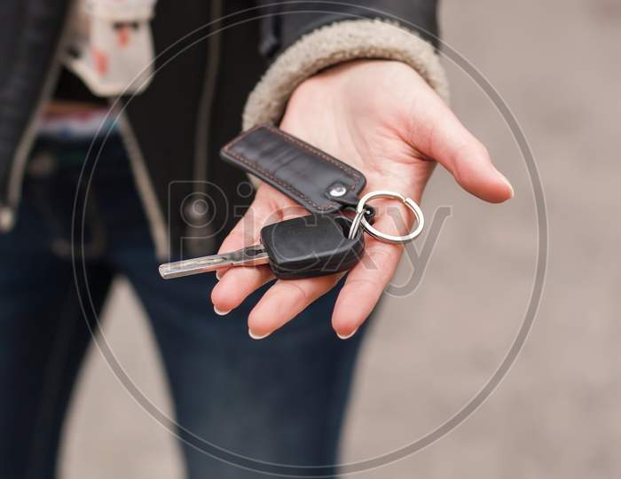 Transfer Of Car Keys In Female Handsl, Black Jacket
