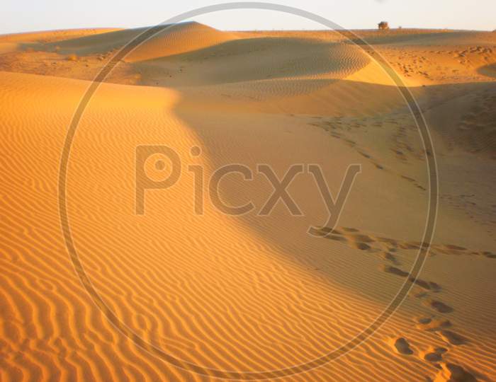 foot mark on sand dunes.
