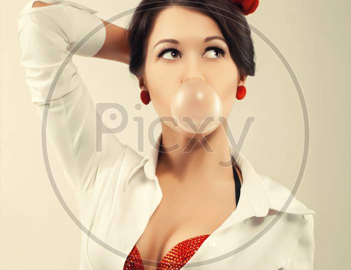 Pinup Woman With Cud In Studio. Back To 1950S