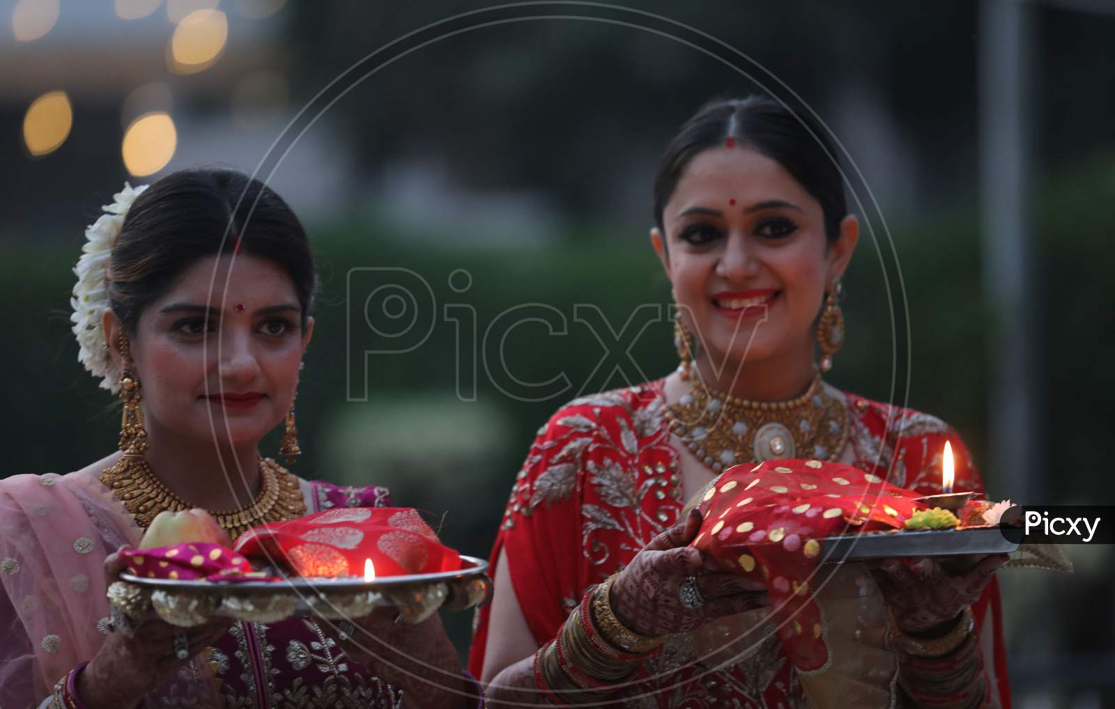 Married women perform rituals during 'Karwa Chauth' festival, in Jammu,4 November,2020.