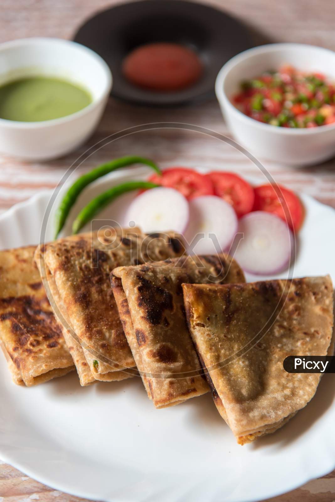 Pieces of popular Indian breakfast item alu paratha