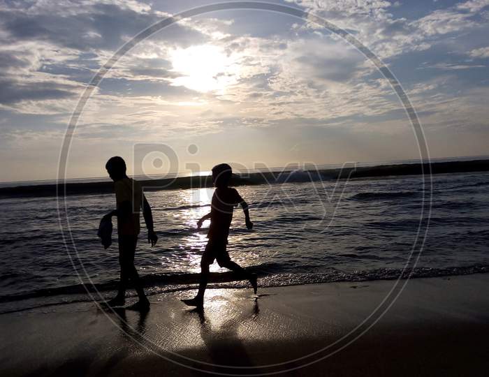 children playing at sea shore