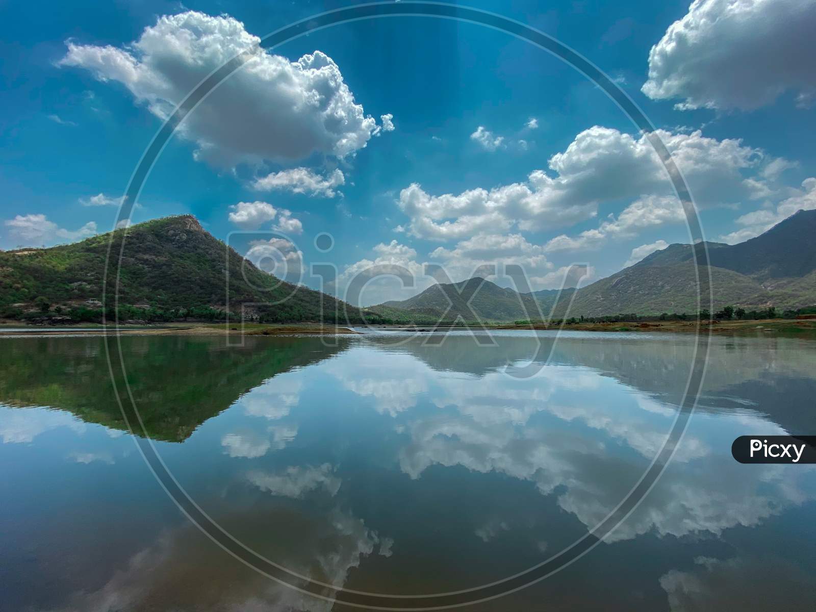 Landscape of lake with reflection of mountains