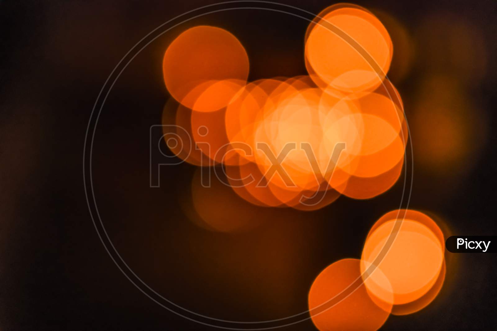 Landscape View Of Out Of Focus Yellow, Orange Light Bokeh Wallpaper Or Background For Texts, Images And Articles, Blank Space With Blurred Background.Large Golden Bokeh.