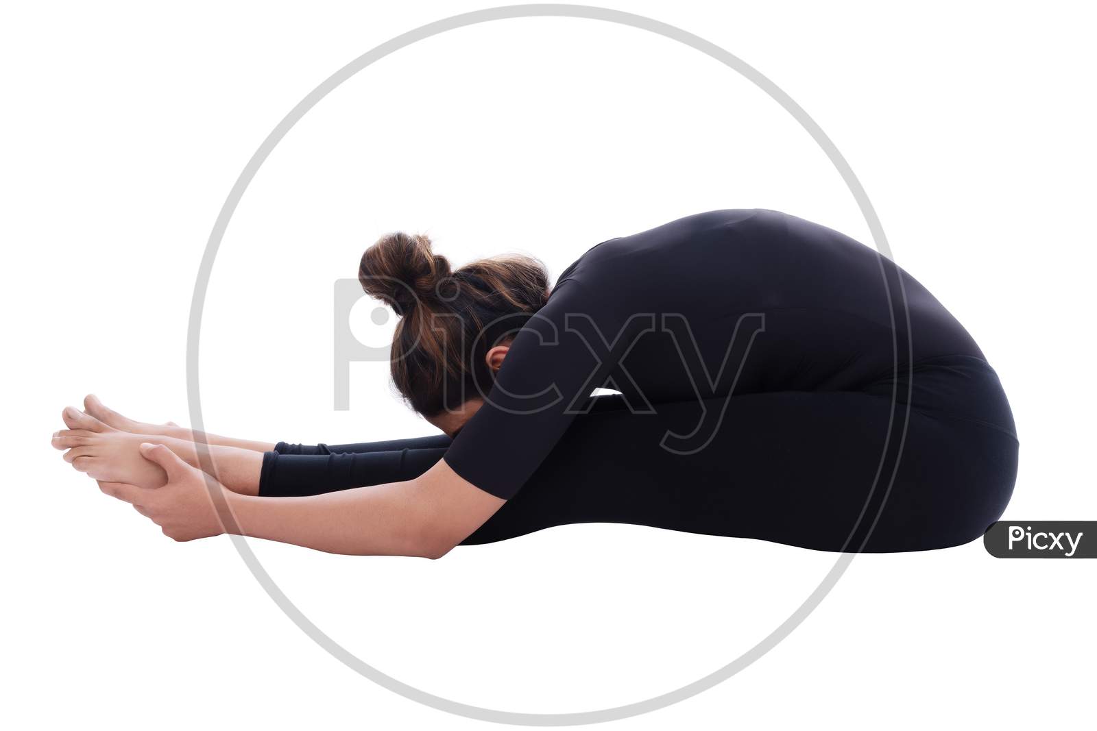 Young Indian female performing yoga