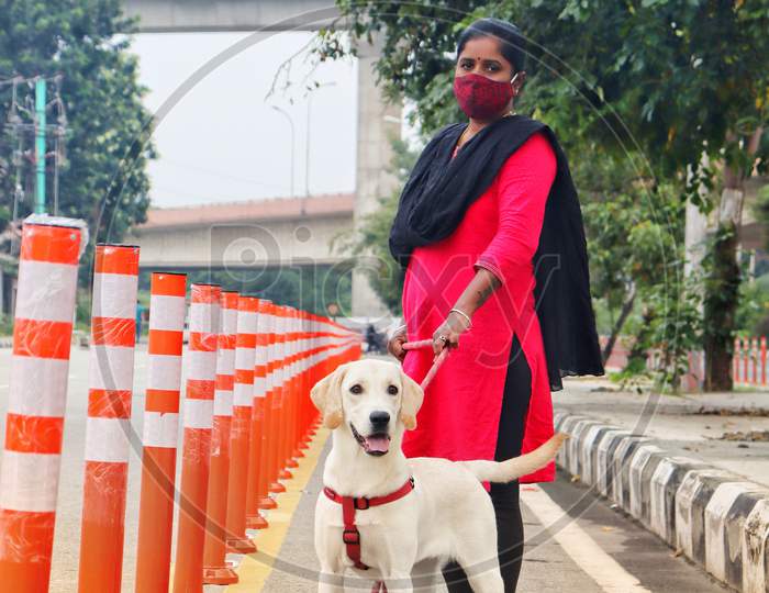 Lady walking a dog