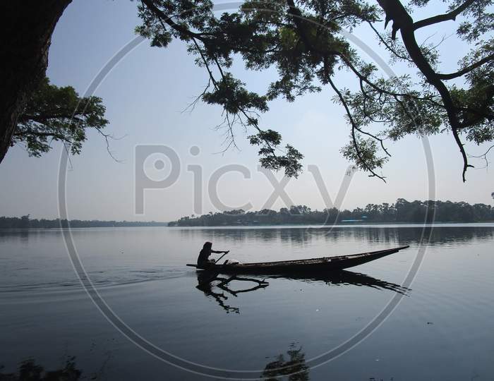 a fisherman on the lake