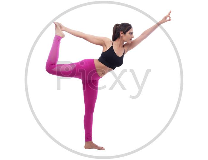 Young Indian female performing yoga