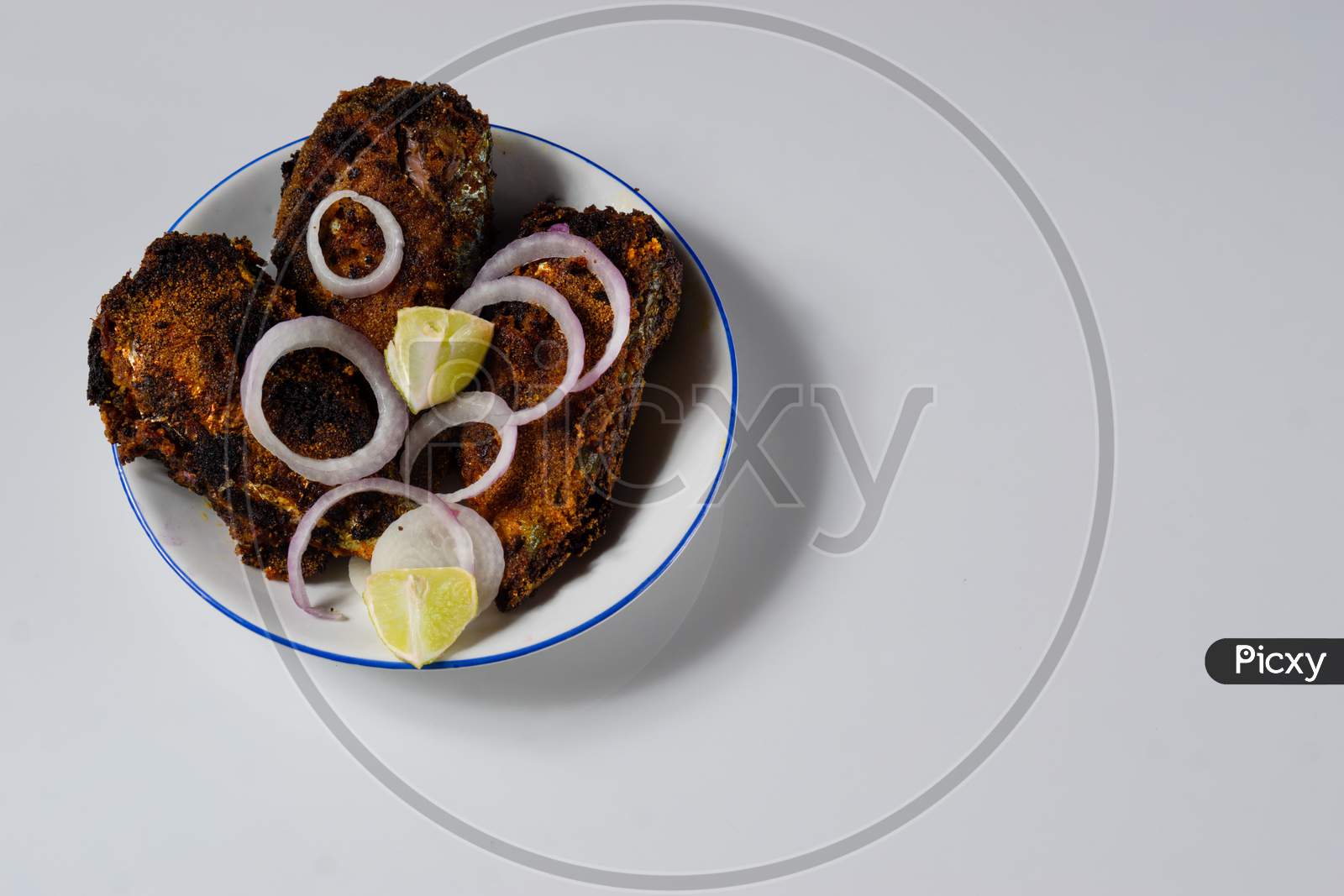 Sea Food Spicy Fish Fry On A White Plate