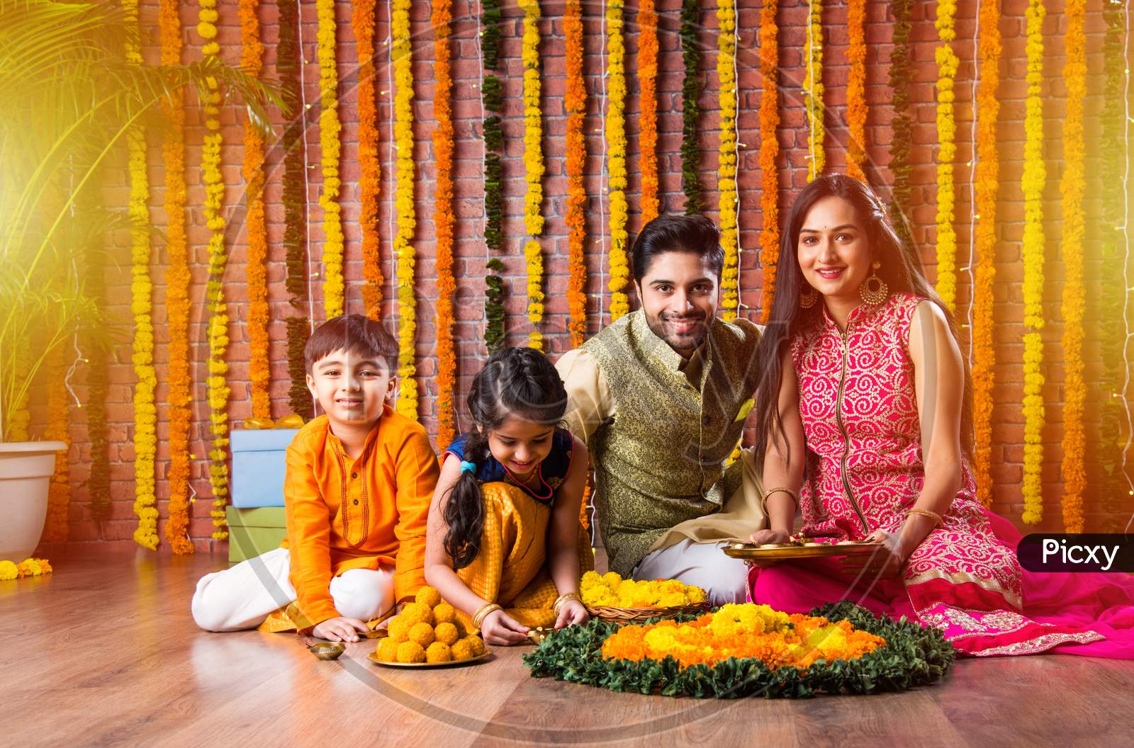 Asian Indian Young Family Of Four Celebrating Diwali, Bhai Dooj Or Raksha Bandhan