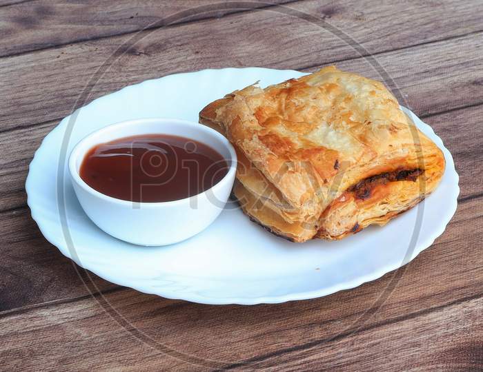 Stuffed Vegetable Puff, Famous Indian Bakery Snack, Served With Tomato Ketchup, Selective Focus