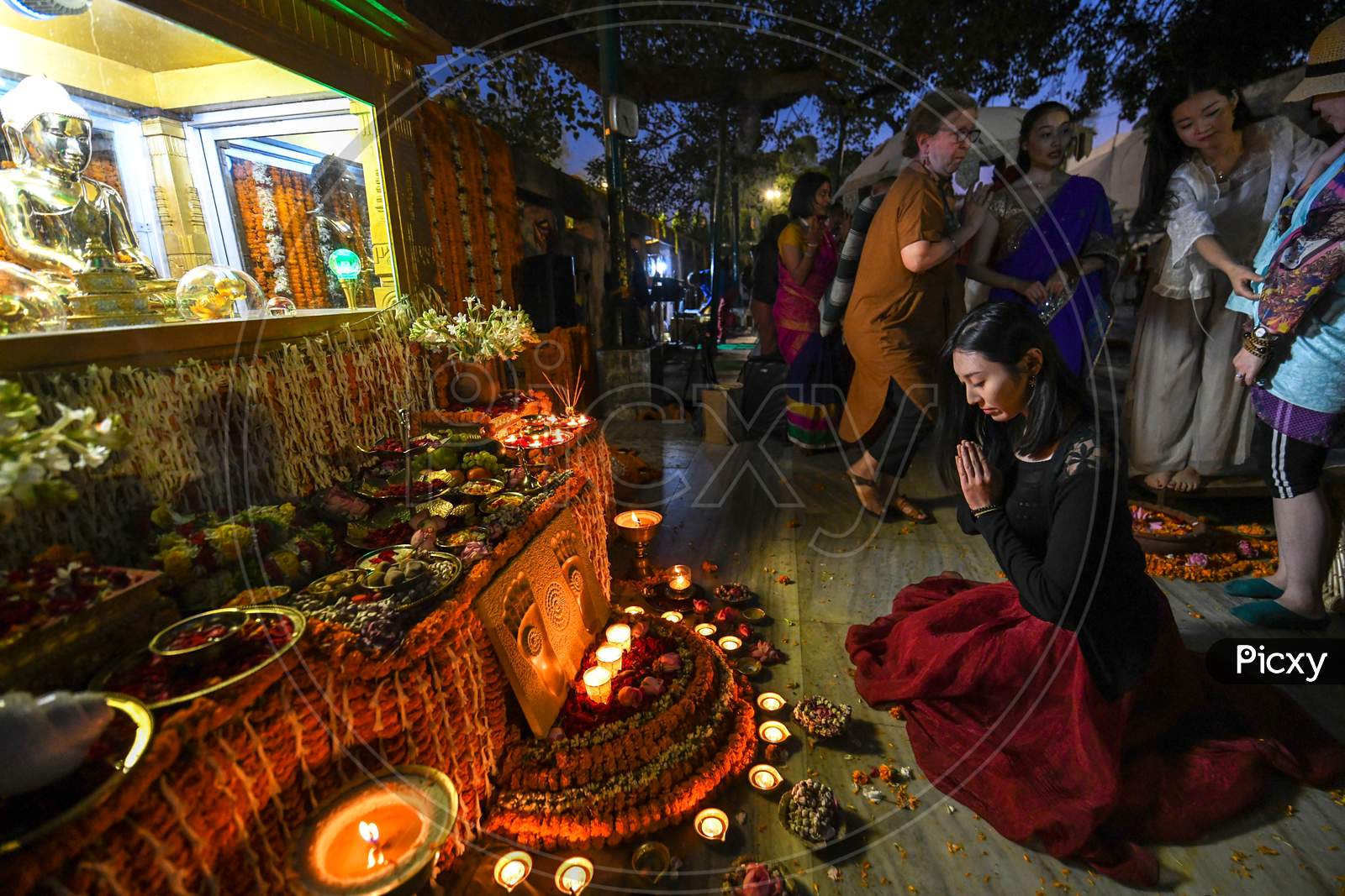 Buddhist Devotees offering prayers