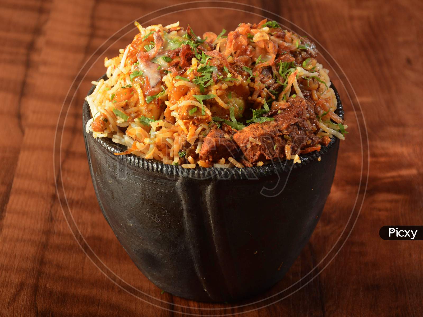 Traditional Hyderabadi Mutton Dum Biryani For Ramadan Kareem, Basmati Rice Cooked With Traditional Spices And Meat Served In Traditional Clay Pot
