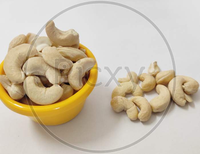 Cashew in a bowl and overflowed