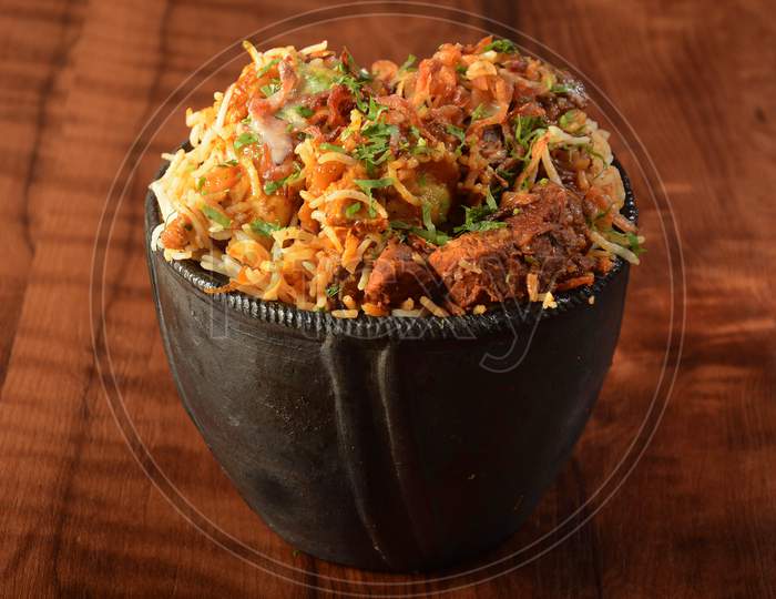Traditional Hyderabadi Mutton Dum Biryani For Ramadan Kareem, Basmati Rice Cooked With Traditional Spices And Meat Served In Traditional Clay Pot