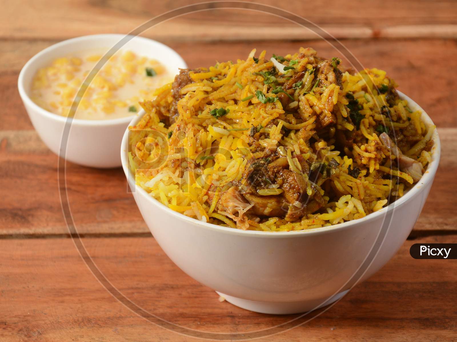 Chicken Makhani Biryani Made Of Basmati Rice Cooked With Masala Spices, Served With Yogurt , Selective Focus