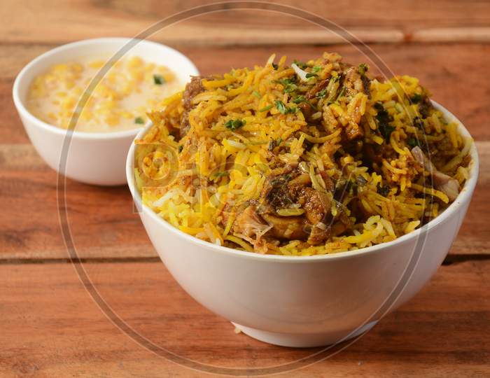 Chicken Makhani Biryani Made Of Basmati Rice Cooked With Masala Spices, Served With Yogurt , Selective Focus