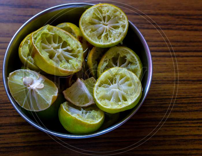 Squeezed Lemon Pieces In A Bowl