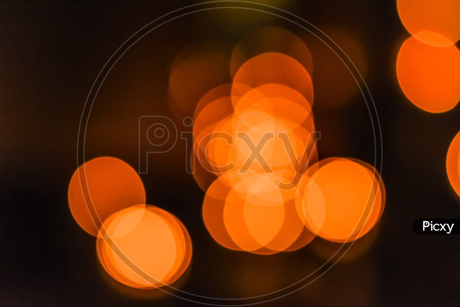 Landscape View Of Out Of Focus Yellow, Orange Light Bokeh Wallpaper Or Background For Texts, Images And Articles, Blank Space With Blurred Background.Large Golden Bokeh.