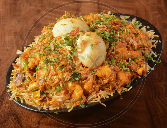 Traditional Mughal Chicken Biryani Made Of Basmati Rice Cooked With Masala Spices And Boiled Eggs, Selective Focus