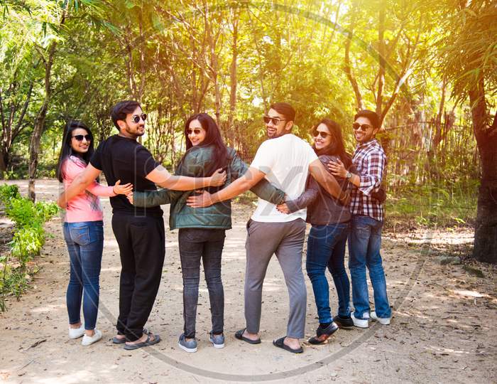 Group Of Indian Asian People Or Young College Friends Having Fun Outdoors