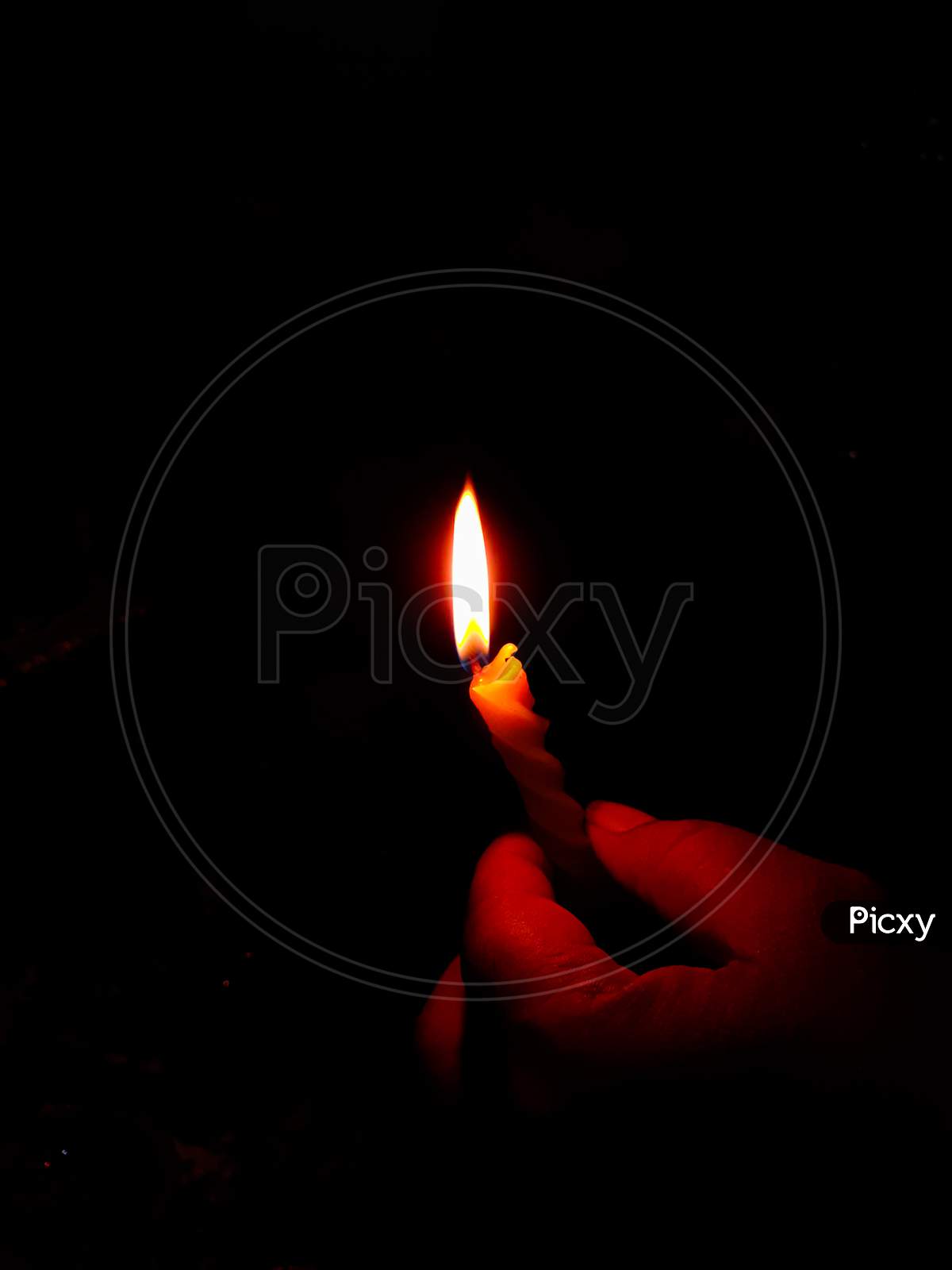 candel brighten the darkness of room