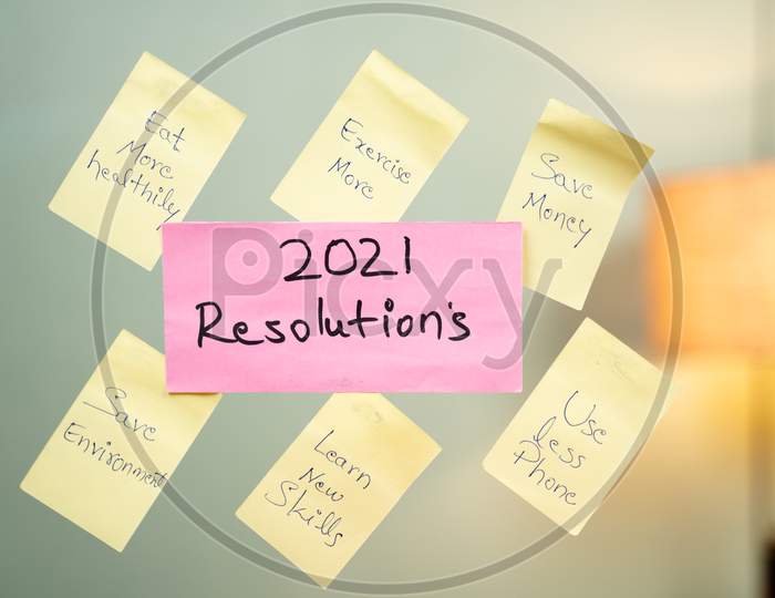 Pasted Common 2021 New Year Resolution Written Sticky Notes On Wall.