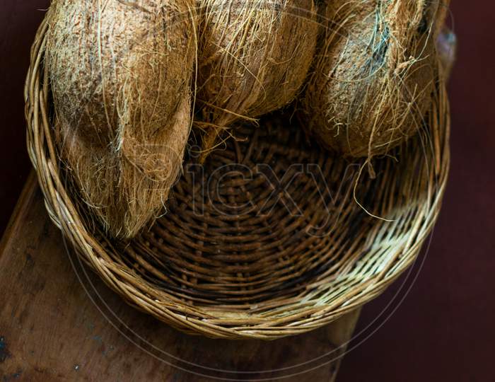 Hairy Coconut In A Cane Basket