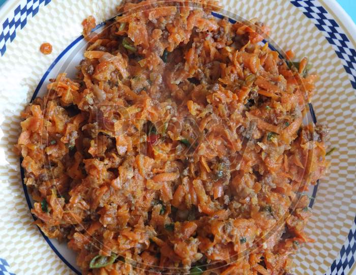 Top Closeup View Of A Homemade Dish Made From Carrot And Vegetables.