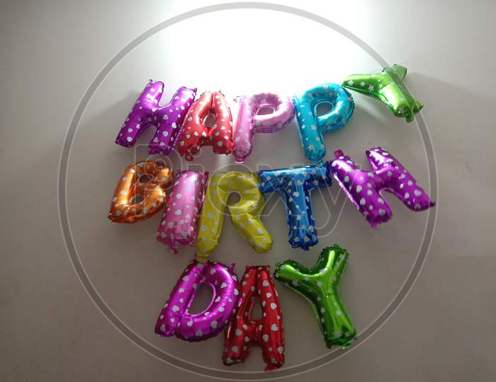 Colorful Birthday Balloon Closeup In House
