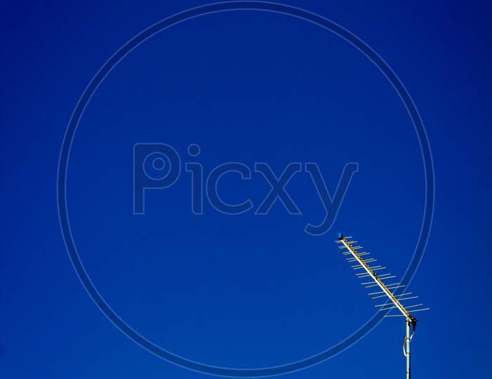 Television Antenna With Large Free Space To Write. Blue Sky Without Clouds. Metal Antenna