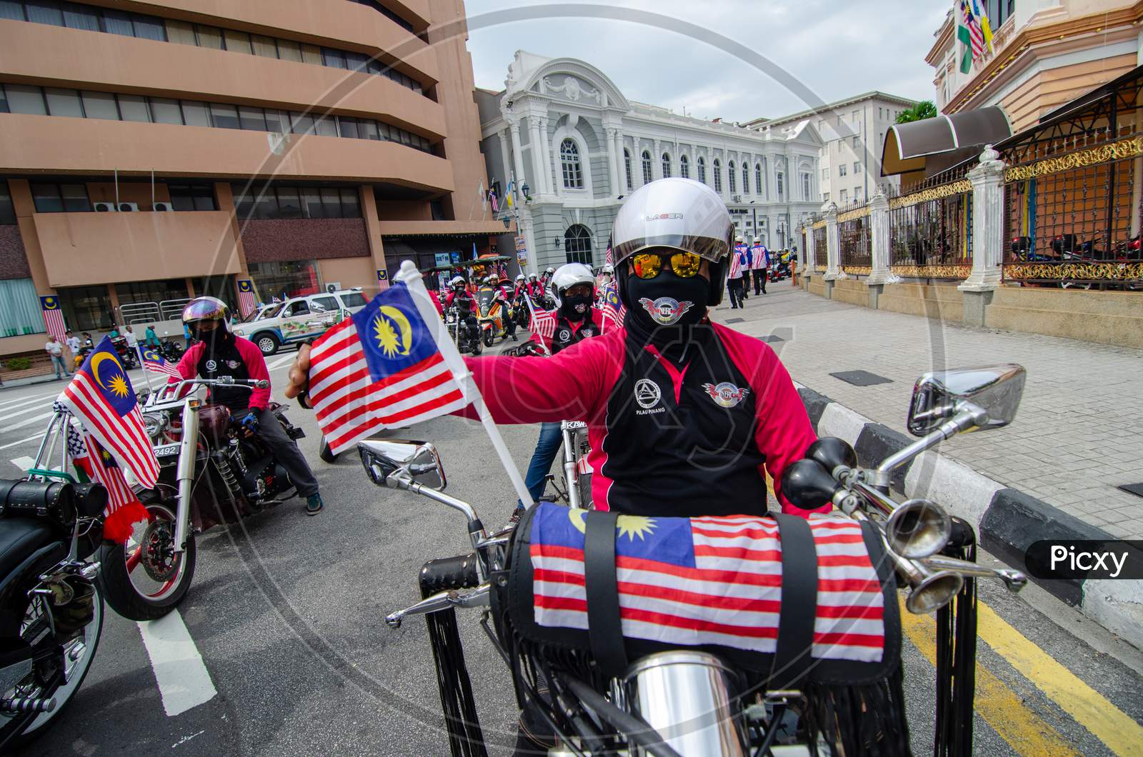 Motorcyclist Hang The Malaysia Flag