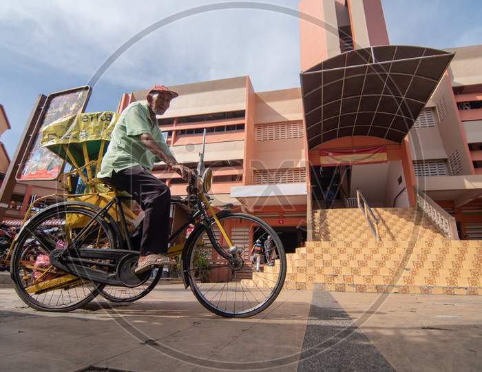 A Man Cycle To Pasar Siti Khdijah