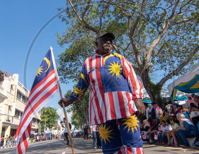 An Indian Man With Malaysia Flag And Costume