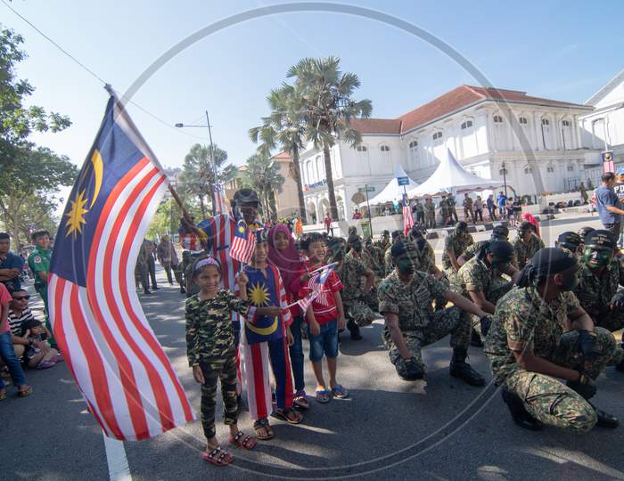 Patriotic Malaysia Wave Malaysia Flag Beside Soldier