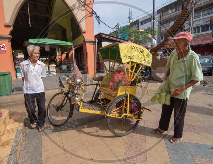 A Man Use Rickshaw To Carry Goods