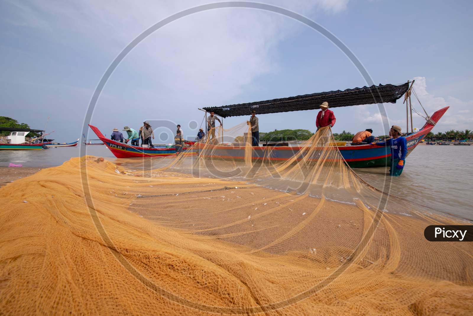 Fishermen Repair Fishing Net