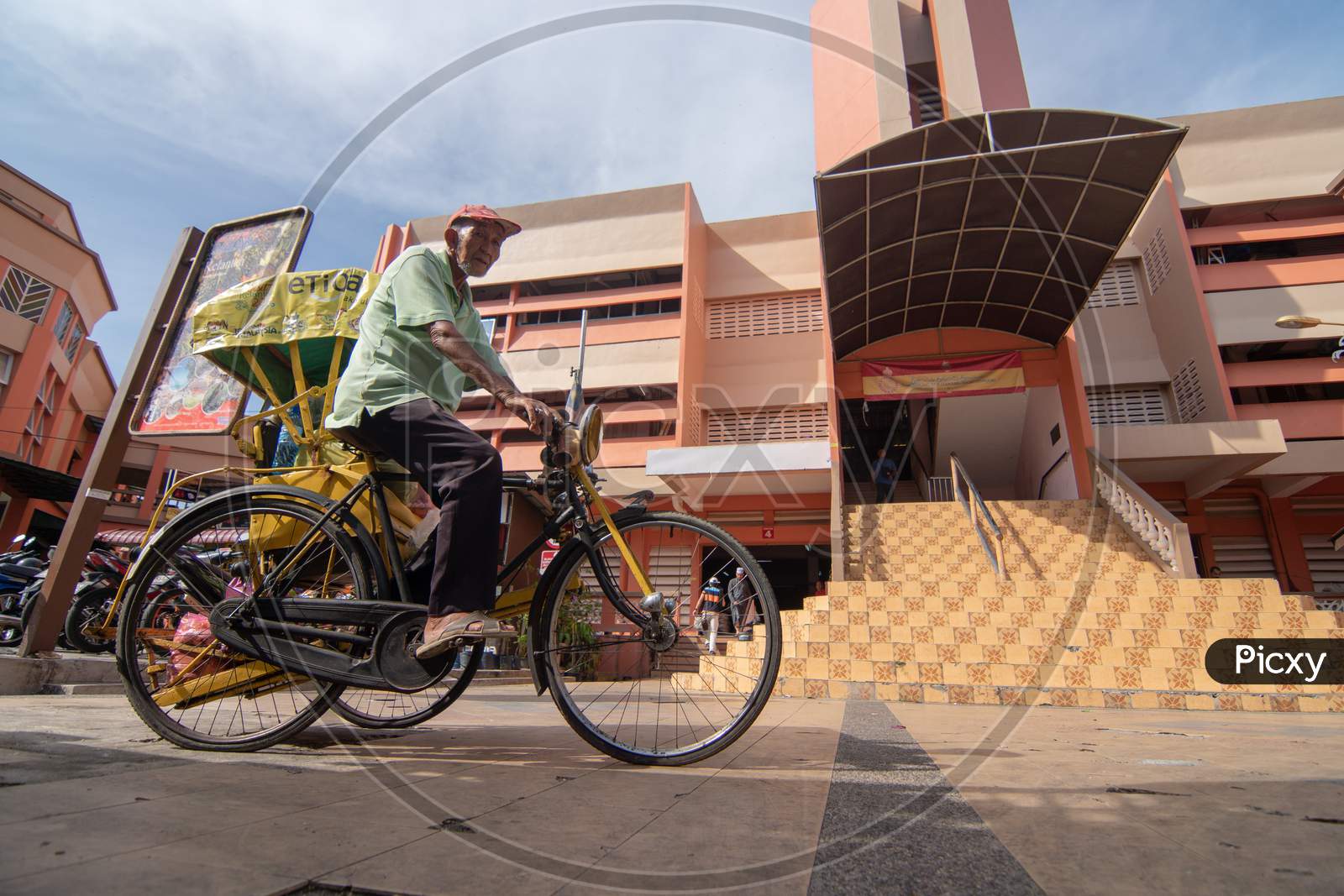 A Man Cycle To Pasar Siti Khdijah