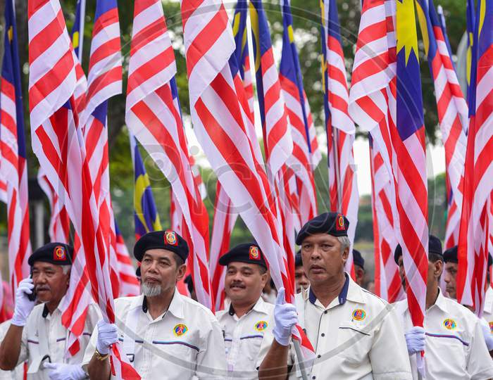 Veteran Hold The Flag During Merdeka Procession