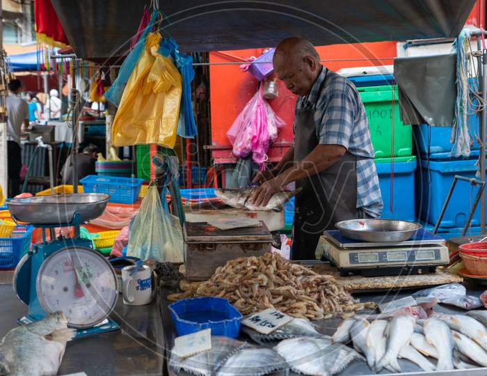 Fish Merchant In The Morning Market